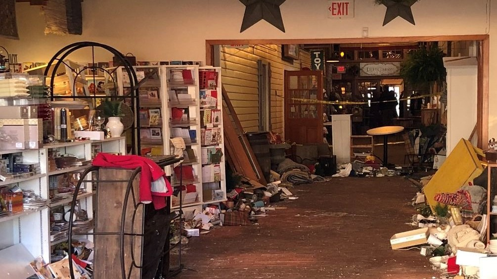Car slams into Excelsior business, 2...